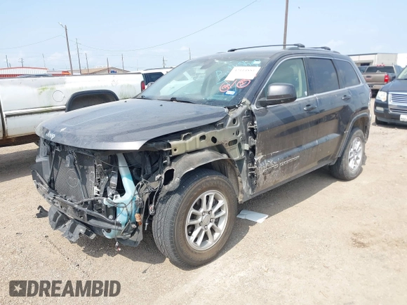2020 Jeep Grand Cherokee Laredo E with VIN 1C4RJEAG2LC284912, listed as a IAAI auction lot 42114881 with 86,579 mi miles and . Bid and sale history available at DreamBid. Image 2.