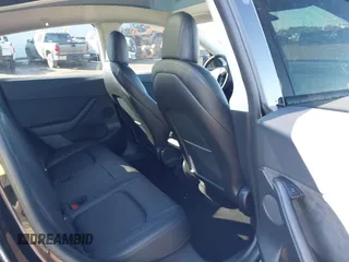 2022 Tesla Model Y Performance with VIN 7SAYGDEFXNF313636, listed as a IAAI auction lot 41660019 with 30,258 mi miles and . Bid and sale history available at DreamBid. Image 8.