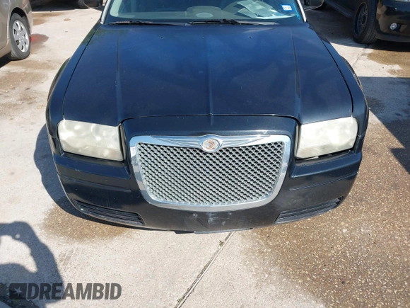 2005 Chrysler 300 with VIN 2C3JA43R65H668010, listed as a IAAI auction lot 41976405 with 216,099 mi miles. Bid and sale history available at carsss.com. Image 6.