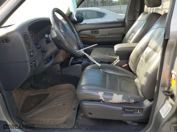2000 Infiniti QX4 with VIN JNRAR07Y6YW081763, listed as a Copart auction lot 75116494 with 297205 miles and Salvage Title. Bid and sale history available at carsss.com. Image 7.