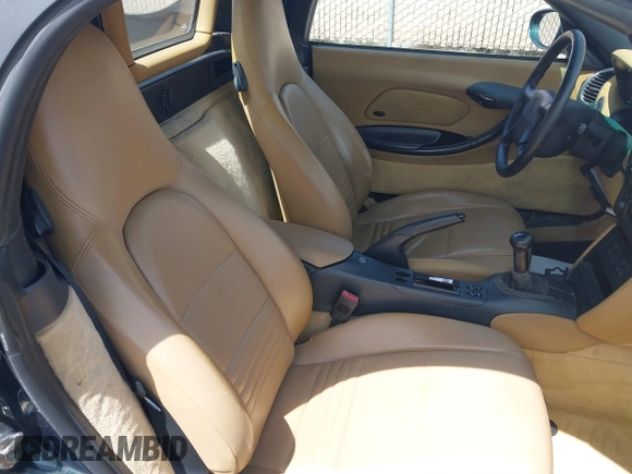 1999 Porsche Boxster with VIN WP0CA2986XU627495, listed as a IAAI auction lot 42112724 with 94,090 mi miles and . Bid and sale history available at DreamBid. Image 8.