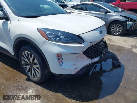 2020 Ford Escape Titanium z VIN 1FMCU9J90LUA39747, wystawiony jako IAAI lot #42369890 z przebiegiem 31 425 mil mil oraz . Historia ofert i sprzedaży dostępna na DreamBid. Obrazek 18.