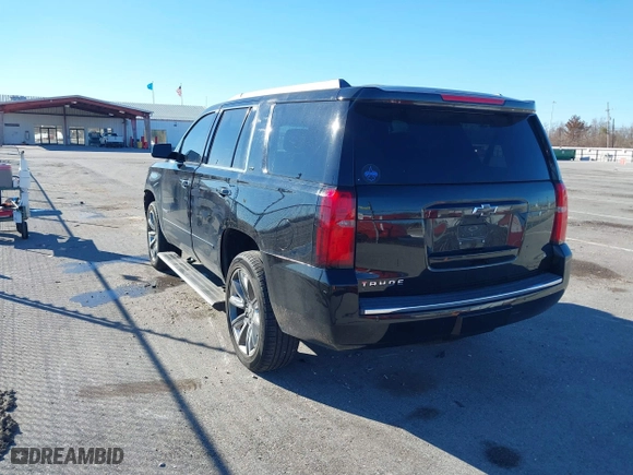 2015 Chevrolet Tahoe LTZ with VIN 1GNSCCKC8FR581994, listed as a IAAI auction lot 41406219 with 187,802 mi miles. Bid and sale history available at carsss.com. Image 3.