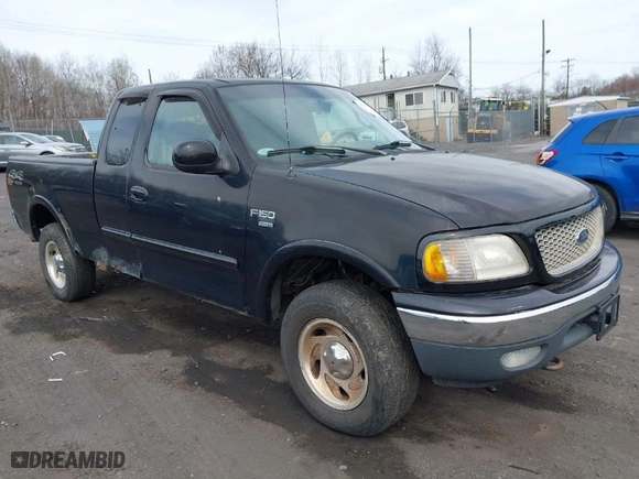 2000 Ford F-150 XL with VIN 1FTRX18WXYNC25817, listed as a IAAI auction lot 41976618 with 148,794 mi miles. Bid and sale history available at carsss.com. Image 1.