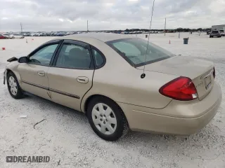 2001 Ford Taurus LX with VIN 1FAFP52U51A145880, listed as a Copart auction lot 77084934 with 54,143 mi miles and Salvage Title. Bid and sale history available at carsss.com. Image 2.
