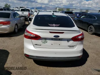 2014 Ford Focus Titanium with VIN 1FADP3J26EL132223, listed as a Copart auction lot 71490004 with 131,233 mi miles and Salvage Title. Bid and sale history available at DreamBid. Image 6.
