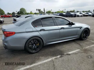 2018 BMW M5 z VIN WBSJF0C50JB282083, wystawiony jako Copart lot #55845673 z przebiegiem 39 691 mil mil oraz . Historia ofert i sprzedaży dostępna na DreamBid. Obrazek 3.