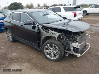 2022 BMW X2 xDrive28i with VIN WBXYJ1C01N5U20171, listed as a IAAI auction lot 41284932 with 64,256 mi miles. Bid and sale history available at carsss.com. Image 1.