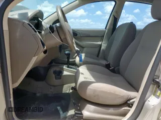 2006 Ford Focus S with VIN 1FAFP34N26W225772, listed as a Copart auction lot 62657045 with 117,078 mi miles and Salvage title. Bid and sale history available at DreamBid. Image 7.