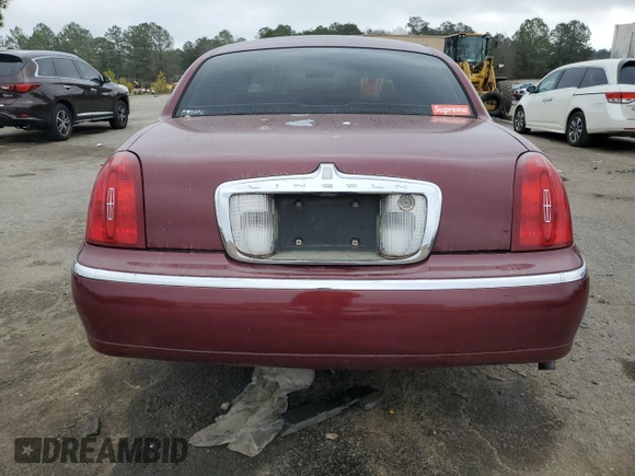 1999 Lincoln Town Car Executive z VIN 1LNHM81W5XY655075, wystawiony jako Copart lot #43263935 z przebiegiem Nie podano mil oraz Szkoda całkowita • Salvage title. Historia ofert i sprzedaży dostępna na DreamBid. Obrazek 6.