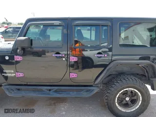 2013 Jeep Wrangler Unlimited Sport with VIN 1C4BJWDG9DL569109, listed as a IAAI auction lot 42115703 with 120,803 mi miles. Bid and sale history available at carsss.com. Image 14.