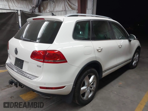 2012 Volkswagen Touareg Sport with VIN WVGFK9BP2CD002991, listed as a IAAI auction lot 42077523 with 94,515 mi miles and . Bid and sale history available at DreamBid. Image 4.