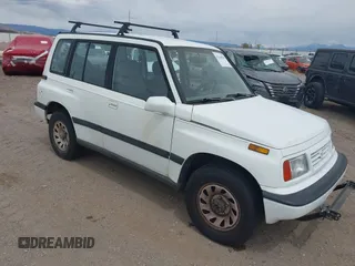 1995 Suzuki Sidekick JX z VIN 2S3TD03V8S6413255, wystawiony jako IAAI lot #42160109 z przebiegiem 225 454 mil mil oraz . Historia ofert i sprzedaży dostępna na DreamBid. Obrazek 1.