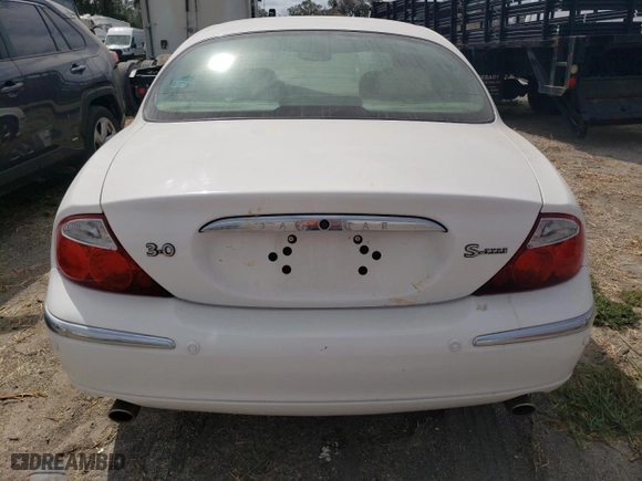 2002 Jaguar S-Type V6 with VIN SAJDA01N72FM21854, listed as a Copart auction lot 75503554 with 0 mi miles and Salvage Title. Bid and sale history available at carsss.com. Image 6.