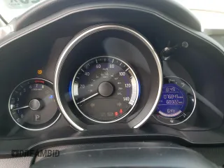 2015 Honda Fit LX с VIN 3HGGK5H57FM725785, выставлен на аукционе Copart как лот 54344325 с пробегом 76 849 миль миль и Списание • Salvage title. История ставок и продаж доступна на DreamBid. Изображение 9.