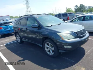 2007 Lexus RX 350 with VIN 2T2GK31U07C021695, listed as a IAAI auction lot 42032252 with 146,023 mi miles. Bid and sale history available at carsss.com. Image 1.