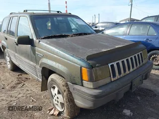 1993 Jeep Grand Cherokee Laredo with VIN 1J4GZ58S1PC680016, listed as a IAAI auction lot 41813392 with 149,520 mi miles. Bid and sale history available at carsss.com. Image 1.