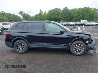 2021 Volkswagen Tiguan S z VIN 3VV0B7AX3MM031908, wystawiony jako IAAI lot #42504384 z przebiegiem 42 510 mil mil oraz . Historia ofert i sprzedaży dostępna na DreamBid. Obrazek 13.