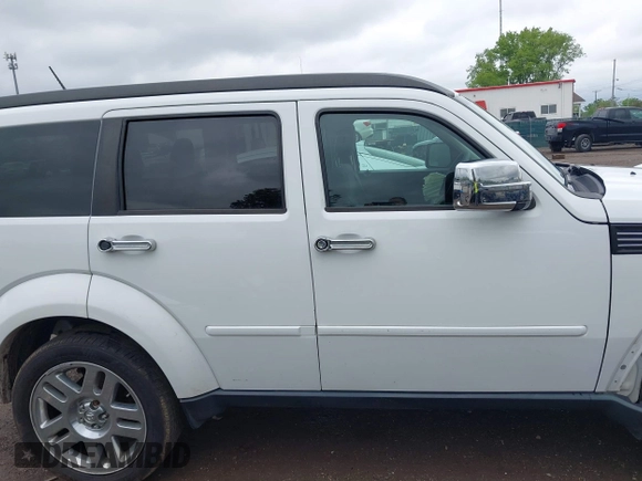 2011 Dodge Nitro Heat z VIN 1D4PU4GK7BW598432, wystawiony jako IAAI lot #42252036 z przebiegiem 148 329 mil mil oraz . Historia ofert i sprzedaży dostępna na DreamBid. Obrazek 13.