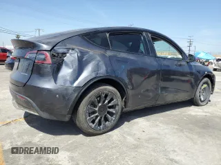 2024 Tesla Model Y Long Range with VIN 7SAYGDEEXRA237667, listed as a Copart auction lot 58260635 with Not provided miles and Salvage title. Bid and sale history available at DreamBid. Image 3.