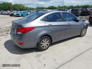 2014 Hyundai Accent GLS with VIN KMHCT4AE4EU661497, listed as a IAAI auction lot 41987134 with 129,508 mi miles. Bid and sale history available at carsss.com. Image 4.