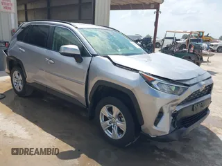 2020 Toyota RAV4 XLE with VIN JTMP1RFV0LJ030911, listed as a IAAI auction lot 42414824 with 21,097 mi miles and . Bid and sale history available at DreamBid. Image 1.