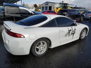 1998 Mitsubishi Eclipse with VIN 4A3AK44YXWE152916, listed as a Copart auction lot 84327974 with 115,415 mi miles and Salvage Title. Bid and sale history available at DreamBid. Image 3.