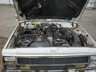 1990 Jeep Grand Wagoneer z VIN 1J4FN78L0LL282169, wystawiony jako Copart lot #59809545 z przebiegiem 194 382 mil mil oraz Czysty tytuł • Clean title. Historia ofert i sprzedaży dostępna na DreamBid. Obrazek 12.