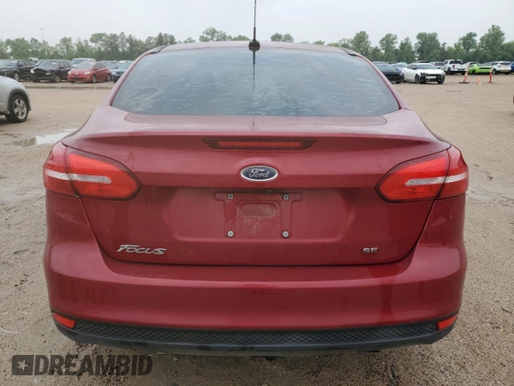 2017 Ford Focus SE z VIN 1FADP3F25HL299153, wystawiony jako Copart lot #53908065 z przebiegiem 108 745 mil mil oraz Szkoda całkowita • Salvage title. Historia ofert i sprzedaży dostępna na DreamBid. Obrazek 6.