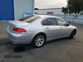 2006 BMW 7 Series 750i with VIN WBAHL83586DT05258, listed as a Copart auction lot 77033744 with 129,376 mi miles and Salvage Title. Bid and sale history available at carsss.com. Image 3.