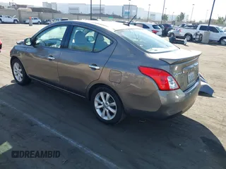 2014 Nissan Versa S with VIN 3N1CN7APXEL817010, listed as a IAAI auction lot 41460129 with 137,040 mi miles. Bid and sale history available at carsss.com. Image 3.