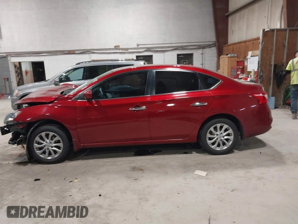 2019 Nissan Sentra S z VIN 3N1AB7AP7KY257283, wystawiony jako IAAI lot #42012338 z przebiegiem 103 503 mil mil oraz . Historia ofert i sprzedaży dostępna na DreamBid. Obrazek 15.