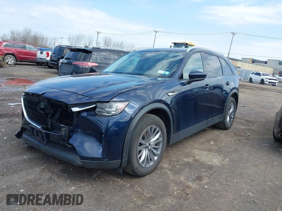 2024 Mazda CX-90 Preferred z VIN JM3KKBHA5R1158229, wystawiony jako IAAI lot #42008464 z przebiegiem 20 817 mil mil oraz . Historia ofert i sprzedaży dostępna na DreamBid. Obrazek 2.