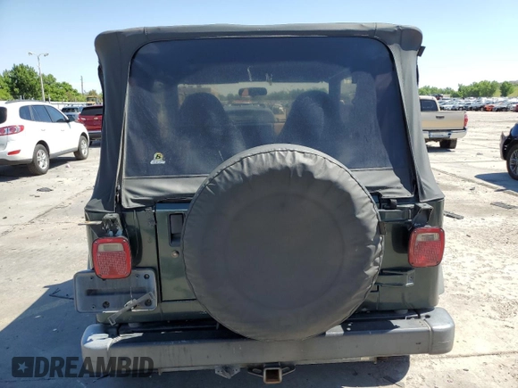 2002 Jeep Wrangler Sport с VIN 1J4FA49SX2P738105, выставлен на аукционе Copart как лот 60320775 с пробегом 402 518 миль миль и Списание • Salvage title. История ставок и продаж доступна на DreamBid. Изображение 6.