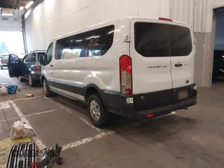 2019 Ford Transit Passenger XL with VIN 1FBZX2ZM8KKB24761, listed as a IAAI auction lot 40978107 with 153,669 mi miles. Bid and sale history available at carsss.com. Image 3.