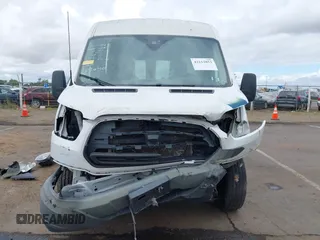 2015 Ford Transit Cargo with VIN 1FTNR2CMXFKA83472, listed as a IAAI auction lot 42212853 with 88,182 mi miles and . Bid and sale history available at DreamBid. Image 13.