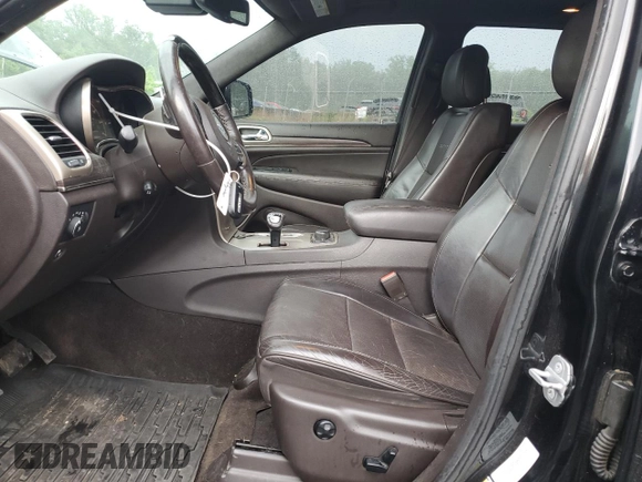 2014 Jeep Grand Cherokee Summit с VIN 1C4RJFJM2EC302534, выставлен на аукционе Copart как лот 61660155 с пробегом 206 823 миль миль и Списание • Salvage title. История ставок и продаж доступна на DreamBid. Изображение 7.