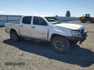2015 Toyota Tacoma with VIN 3TMLU4EN0FM164688, listed as a Copart auction lot 55614645 with 212,613 mi miles and Salvage Title. Bid and sale history available at DreamBid. Image 4.