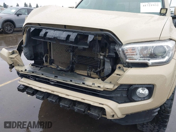 2016 Toyota Tacoma SR5 with VIN 3TMDZ5BN3GM003351, listed as a IAAI auction lot 41721932 with 100,774 mi miles and . Bid and sale history available at DreamBid. Image 18.