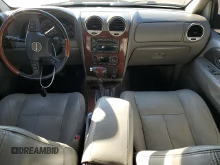 2006 GMC Envoy Denali with VIN 1GKES63M962257466, listed as a Copart auction lot 76821124 with 171,266 mi miles and Salvage Title. Bid and sale history available at carsss.com. Image 8.