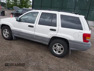 2000 Jeep Grand Cherokee Laredo z VIN 1J4GW48S2YC390226, wystawiony jako IAAI lot #42326715 z przebiegiem 273 806 mil mil oraz . Historia ofert i sprzedaży dostępna na DreamBid. Obrazek 3.