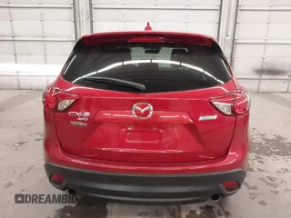 2016 Mazda CX-5 Grand Touring with VIN JM3KE4DY7G0731057, listed as a IAAI auction lot 41118072 with 134,107 mi miles and . Bid and sale history available at carsss.com. Image 17.
