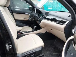 2018 BMW X1 xDrive28i with VIN WBXHT3C39J3H30531, listed as a IAAI auction lot 41890734 with 59,147 mi miles. Bid and sale history available at carsss.com. Image 5.