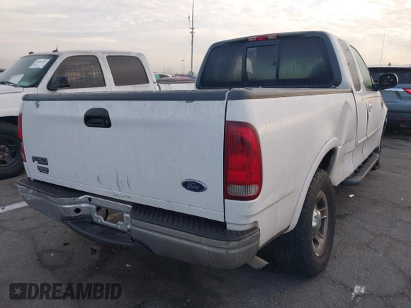 1999 Ford F-150 XL with VIN 1FTRX18L1XKB61205, listed as a IAAI auction lot 40991236 with 178,889 mi miles. Bid and sale history available at carsss.com. Image 4.