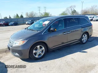 2012 Honda Odyssey Touring with VIN 5FNRL5H9XCB077351, listed as a IAAI auction lot 42045976 with 146,290 mi miles and . Bid and sale history available at DreamBid. Image 17.
