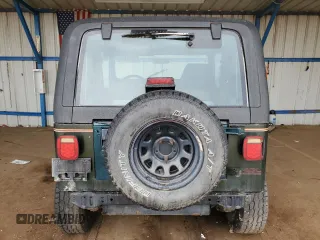 1995 Jeep Wrangler Sahara with VIN 1J4FY49S1SP256179, listed as a Copart auction lot 61137334 with 187,391 mi miles and Salvage Title. Bid and sale history available at carsss.com. Image 6.