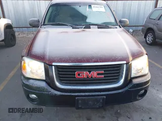 2005 GMC Envoy SLT with VIN 1GKDT13S452115924, listed as a IAAI auction lot 41443704 with 215,402 mi miles. Bid and sale history available at carsss.com. Image 6.