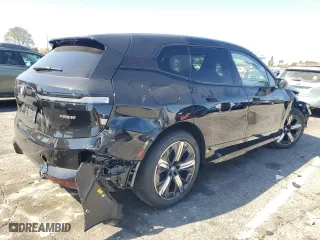 2025 BMW iX xDrive50 with VIN WB523CF05SCT96190, listed as a Copart auction lot 52585415 with 1,894 mi miles and Salvage Title. Bid and sale history available at carsss.com. Image 3.