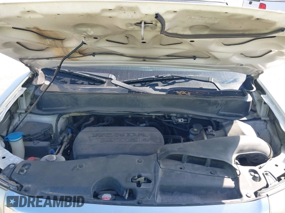 2015 Honda Pilot EX-L with VIN 5FNYF4H56FB061663, listed as a IAAI auction lot 41873152 with 211,876 mi miles and . Bid and sale history available at carsss.com. Image 10.