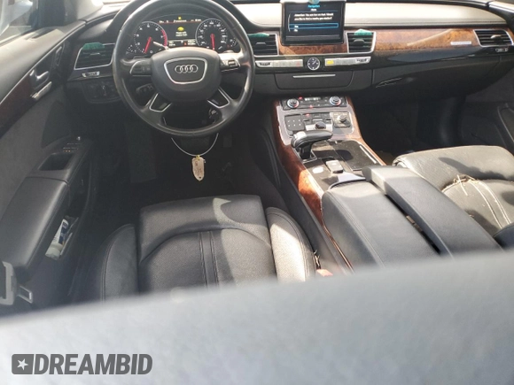 2014 Audi A8 3.0T z VIN WAURGAFD5EN007438, wystawiony jako Copart lot #47979945 z przebiegiem 147 236 mil mil oraz Szkody całkowita. Historia ofert i sprzedaży dostępna na DreamBid. Obrazek 8.
